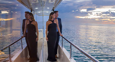 couple standing outside of yacht