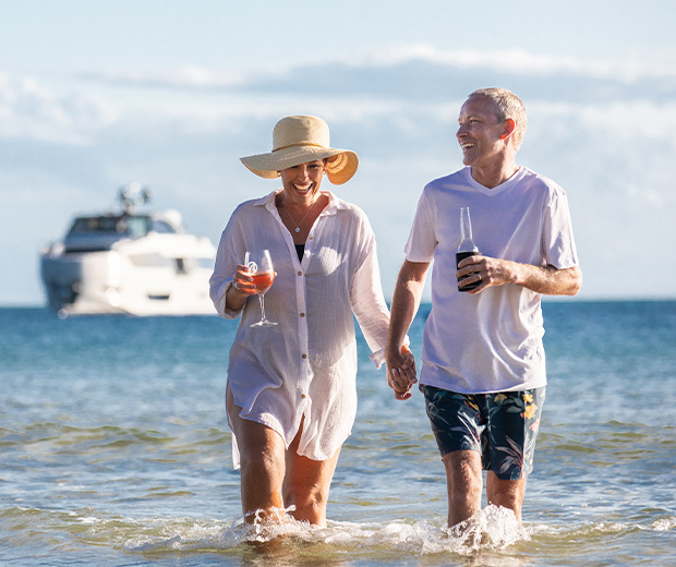 man and woman walking in the water