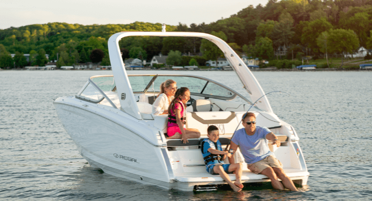 Family fishing on the back of boat