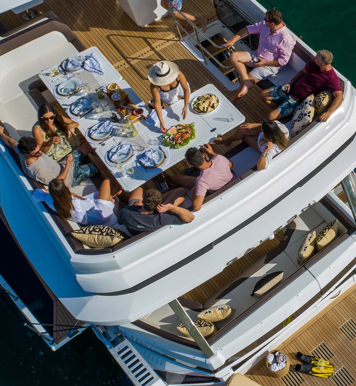 group of people on flybridge of boat dining