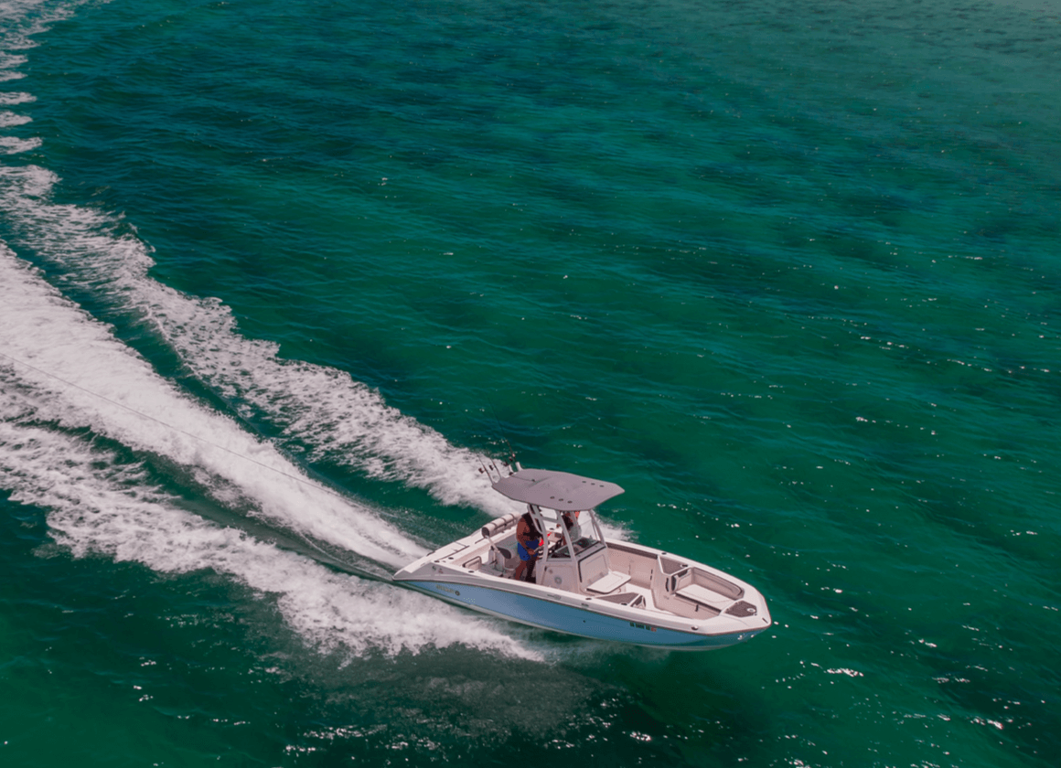 Speedboat sailing across blue-green water
