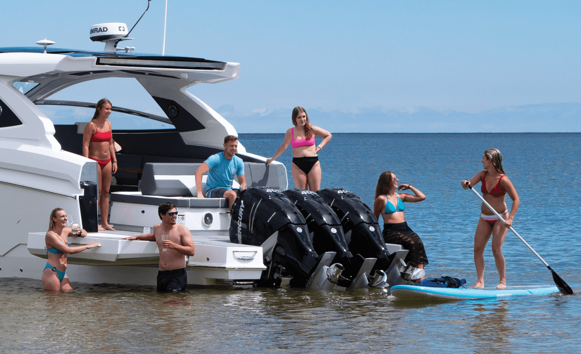 Family enjoying watersports near back of boat