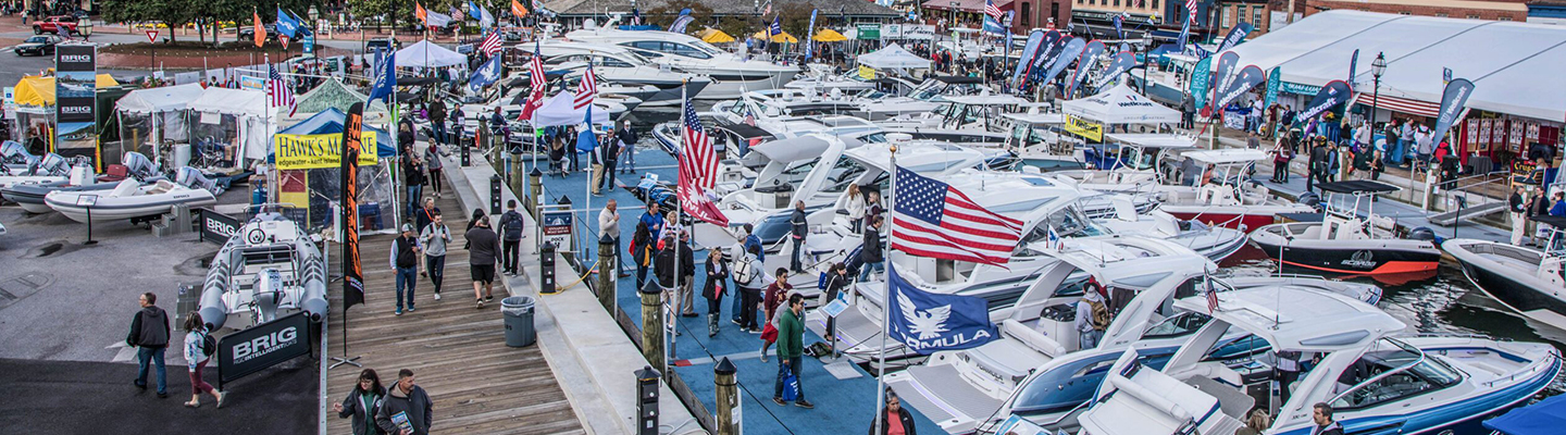 A bustling marina features numerous luxury boats and yachts on display at the Annapolis Powerboat Show.